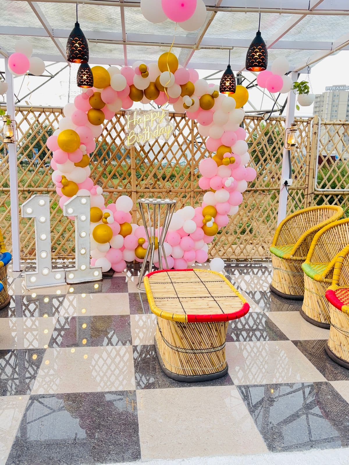Birthday balloon ring decoration on a Noida high-rise terrace