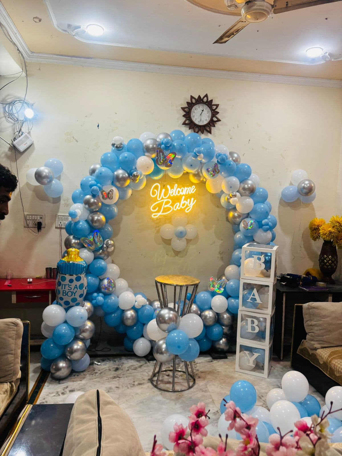 Blue and silver 'Welcome Baby' arch with an 'It's a Boy' bottle and 'BABY' blocks